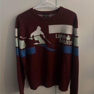 Lake Louise Maroon Graphic Ski Crewneck Sweater by Locale